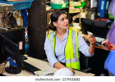 Asian Indian Beautiful Woman Warehouse Worker Checking Order  In Desktop Computer At Office Warehouse Factory. Check Emails.