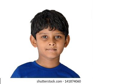 An Asian, Indian boy of age 6 Years with a beautiful smile in White background, Isolate image.
