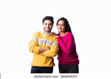 Asian Indian Couple Wears Colourful Warm Sweater Or Woolen Winter Cloths, Standing Isolated Against White Background