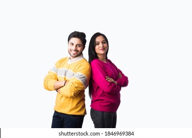 Asian Indian Couple Wears Colourful Warm Sweater Or Woolen Winter Cloths, Standing Isolated Against White Background