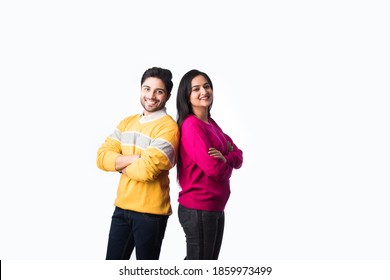 Asian Indian Couple Wears Colourful Warm Sweater Or Woolen Winter Cloths, Standing Isolated Against White Background