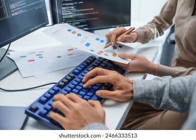 asian and Indian Developer team discussion feedback analysis coding data with software computer at office
