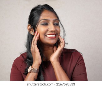 Asian Indian Origin Dark Skin Tone Beautiful Woman Facial Hand Expression Witty Smile Hand On Cheek