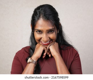 Asian Indian Origin Dark Skin Tone Beautiful Woman Facial Hand Expression Witty Smile Hand On Cheek