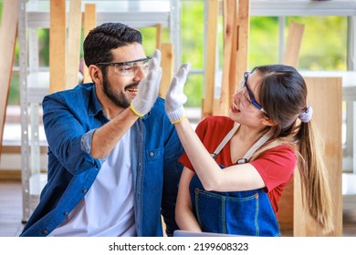 Asian Indian Professional Bearded Male And Female Engineer Architect Foreman Labor Worker Colleague Wear Safety Goggles And Gloves Smiling High Five Greeting Celebrating Together In Construction Site.