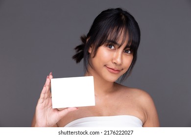 Asian Indian Woman Show Beautiful Smile Happy Lips, Hold Empty Blank Package Box For Treatment Skin Care. India Female Feel Wellbeing With Medicine Capsule In Studio Over Gray Background Isolated