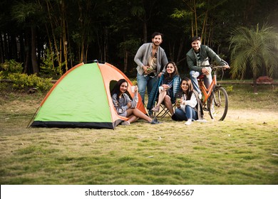 Asian Indian Young Friends Have Good Time On Camping Trip, Relaxing Vacation With Fun Outside Tents