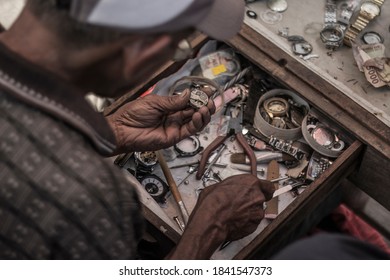 Asian Indonesia Man Repairing Clock With Hand And Repair Time