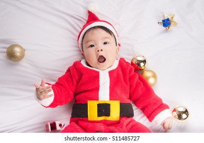 Asian Infant Baby In Santa Costume Christmas Celebration