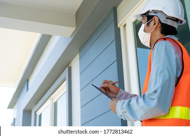 Asian inspectors or engineers are examining the construction structure building or the decoration details using checklists and checks before sending the house to the customer. - Shutterstock ID 1772813462