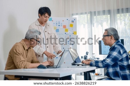 Asian Instructor Teaching Senior in Software Programming and Training Collaboration
