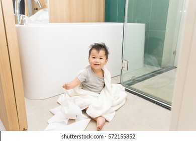 Asian Kid In The Bathroom With Bathtub