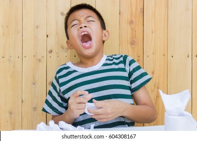 Asian Kid Blow The Nose And Sneeze.