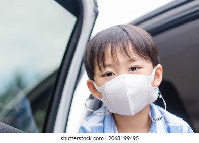 Asian Kid Boy With Mask Outdoor At School.safety, Protect In Travel.people Wearing Masks In The Car To School Outdoor Masked Reopen School, Airpots, Train Station, Bus Stop.Student Child With Masked.