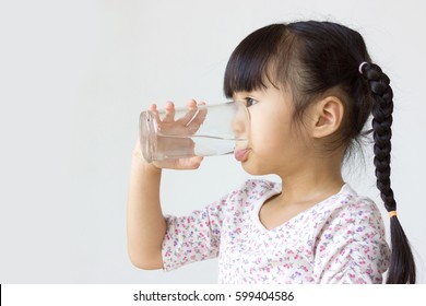 Asian Kid Drinking Water. 