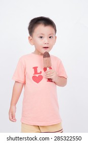 Asian Kid Eating Chocolate Ice Cream Bar, Isolated On White Background