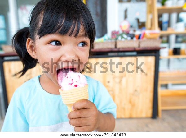 Asian Kid Eating Ice Cream Stock Photo (Edit Now) 791843473