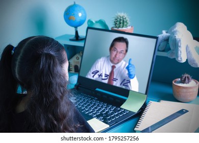 Asian Kid Girl Learning Education Mathematics Online Internet Studying Through A Computer Screen With Male Teachers Teaching At Home. Concept Education Social Distance, New Normal, During Quarantine.