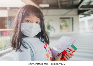 Asian Kid Girl Student Wearing Face Mask.student Kid Girl Walking In School.Reopen School Back To School During Covid19 Coronavirus.Medical Mask Lifestyle.Education Healthcare.Primary School Child.