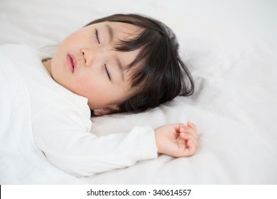 Asian Kid Having Nap Time.