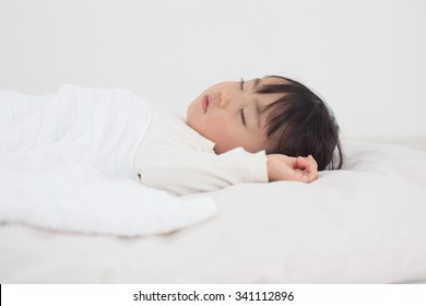 Asian Kid Having Nap Time.