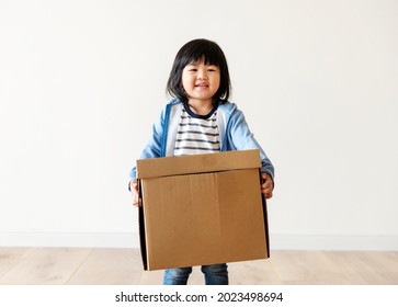 Asian Kid Helping Move Now House