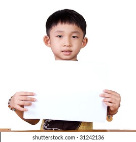 Asian Kid Holding And Showing A Piece Of White Paper