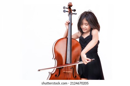 Asian Kid Love Classical Music With Cello String Instrument On White Isolated Background. Music Education Class Concept