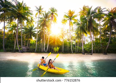 Asian Kid To Play Kayak On The Beach On Koh Kood And Koh Mak, Koh Kood And Koh Mak Is Island On The Sea Of Thailand, This Image Can Use For Advanture, Relax, Travel, Sport, Travel And Family Concept