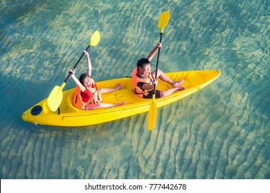 Asian Kid To Play Kayak On The Beach On Koh Kood And Koh Mak, Koh Kood And Koh Mak Is Island On The Sea Of Thailand, This Image Can Use For Advanture, Relax, Travel, Sport, Travel And Family Concept