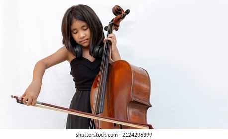 Asian Kid Playing Cello Classic Music Instrument On White Isolated Background