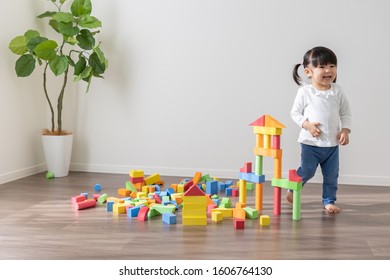 Asian Kid Playing With Toys