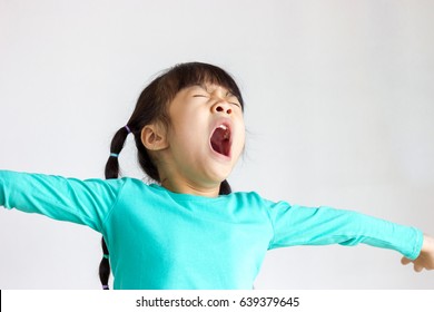 Asian Kid Pretending To Yawn, She Is Very Sleepy.