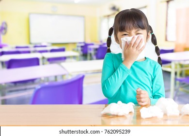 Asian Kid With The Tissue, She Got A Cold. Most Infectious Children Are Caught By Friends At School.