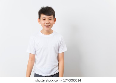 Asian kid in white T-shirt smile on white background. - Powered by Shutterstock