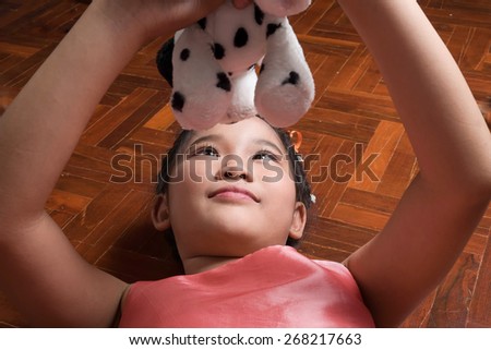 asian kids playing with a doll