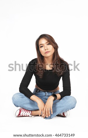 asian lady sit and watch camera on white background