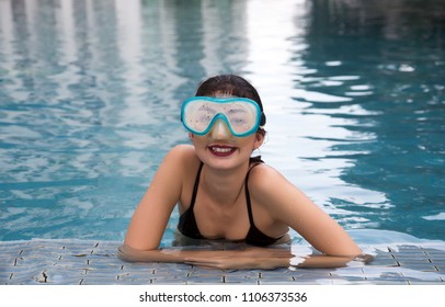 Asian Lady Smile With Snorkle On Swimming Pool