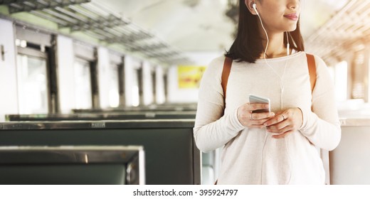 Asian Lady Traveling Commute Train Concept - Powered by Shutterstock