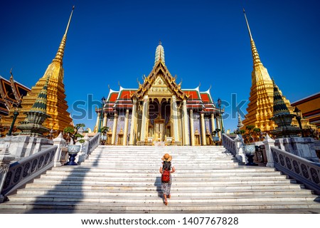 Asian lady walking and travel in Wat Phra Kaew and Grand palace, bangkok city, Thailabd, Asia