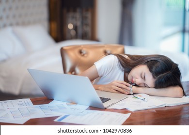 Asian lady work hard and reading before examination until morning in her bedroom, this immage can use for business, working, study, student and education concep