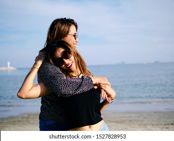 Asian Lesbian Couple Hugging Together On The Beach, Lifestyle Concept.