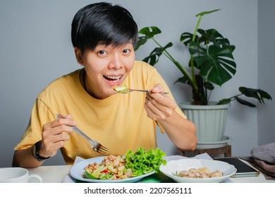 Asian Lesbians Happily On The Dining Table With Thai Food, Papaya Salad And Grilled Chicken. Eat Alone At Home.	