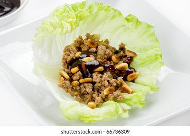 Asian Lettuce Wrap With Ground Beef, Hoisin Sauce And Toasted Pine Nuts.