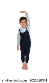 Asian Little Boy Measures The Growth On White Background. Child Estimate Her Height By Hand With Looking Camera. Image With Clipping Path