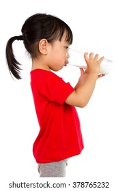 Asian Little Chinese Girl Drinking A Cup Of Milk Isolated On White Background