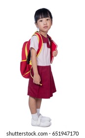 Asian Little Chinese Girl In School Uniform With School Bag In Isolated White Background