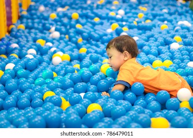 Asian Little Cute Boy Play The Plastic Ball House