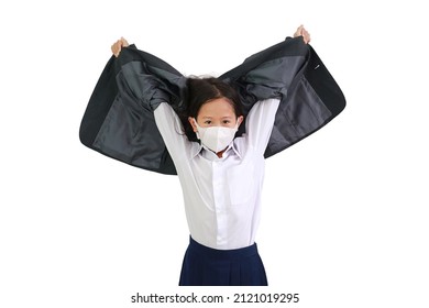 Asian Little Girl Child In White Shirt With Protective Face Mask Raise Hand Up To Taking Off Formal Student Suit Isolated On White Background