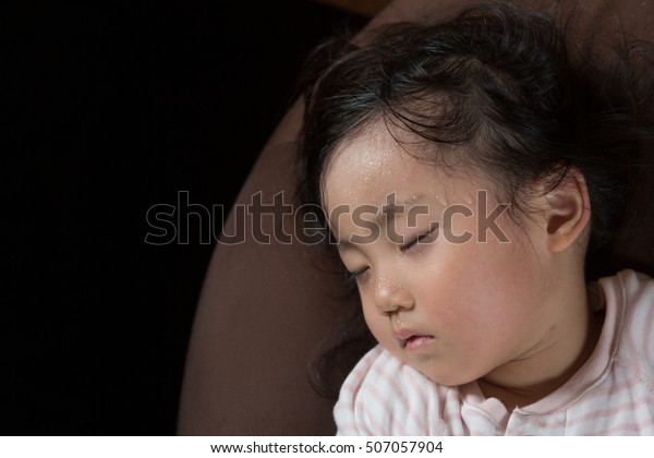 asian little girl gets high fever